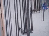 many tools hanging on the wall in the garage
