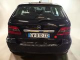 a black car that is parked in a garage