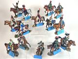 many figurines of people riding horses in a circle