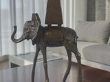 a statue of an elephant with a cone on its head