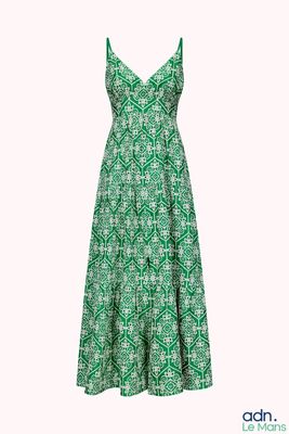 the dress is green and white with a pattern on it