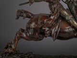 a statue of a man riding a horse with a sword