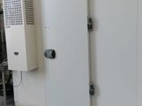 three white doors in a room with a white tiled floor