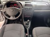 the interior of a car with a steering wheel and dashboard controls