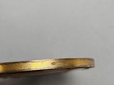 a close up of a gold ring with a diamond on it
