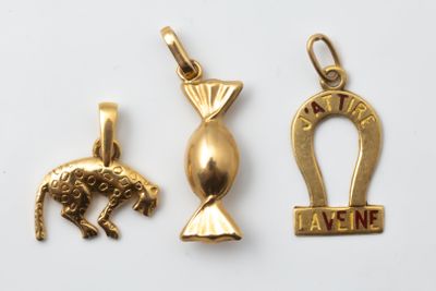 three gold pendants with an ankht, an ankht and an ankht on them
