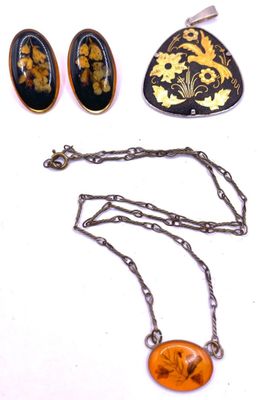 several pieces of jewelry including a necklace, earrings, and a broochet