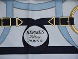a close up of a scarf with a design on it