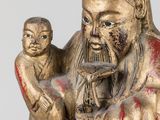 statue of a man holding a baby in his arms