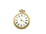 a gold pocket watch with roman numerals on the face
