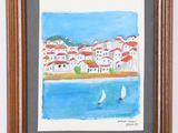 framed watercolor painting of a sailboat in a bay with a town in the background