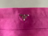 a prada bag with a small logo on the front