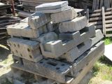 a pile of bricks sitting on the ground in the yard