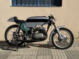 a motorcycle that is parked in front of a building
