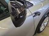 a close up of a car ' s side mirror with a sticker on it