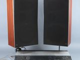 two speakers that are on top of a speaker stand
