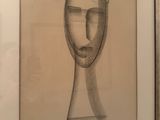 une photo représentant un dessin du visage d'un homme sur le mur