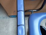 a close up of a blue chair with a blue seat