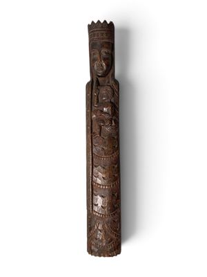 an old wooden carving of a woman with a headdress