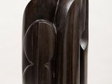 sculptures made of wood on a white surface with a white background