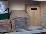 many cutting boards and cutting boards on the shelf