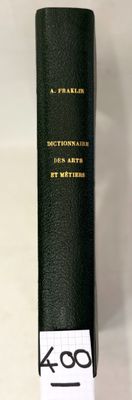 a black book with gold writing on it sitting on a table