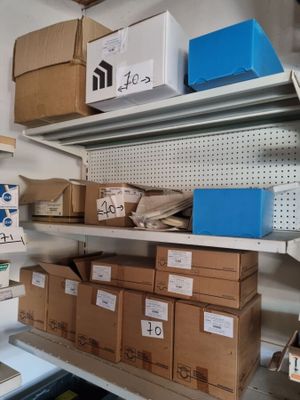 many boxes and boxes on the shelves in the room
