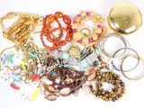 many different types of jewelry on the table