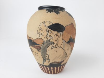 a vase with a picture of a man and a woman on it