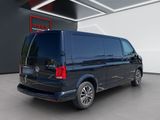 the rear view of a black van parked in a garage