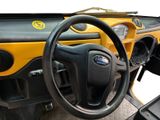 a steering wheel and dashboard of a small vehicle
