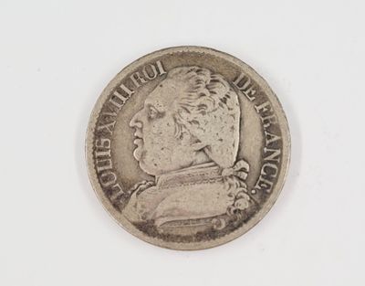 a close up of a coin on a white surface with a white background