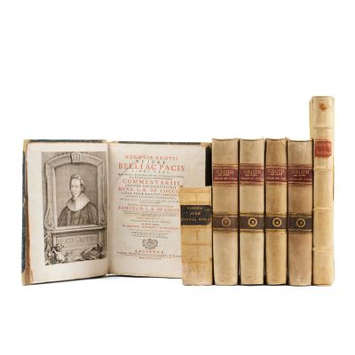 an old book set with a picture of a woman in a dress and a book with a picture of a woman in a dress