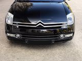 a picture of a black car parked on the side of the road
