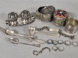 a lot of silver items that are on the table