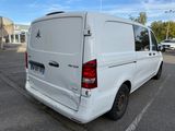 a white van that is parked in a parking lot