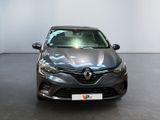the front view of a grey car parked in a showroom