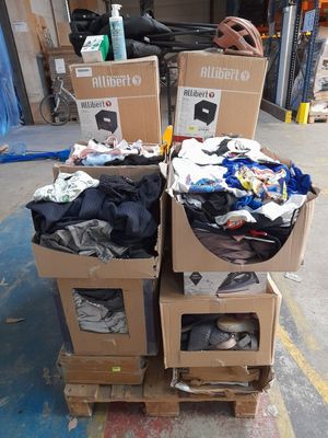 several boxes of clothing are stacked on top of each other