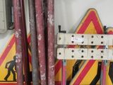 a red and yellow sign and some pipes in a room