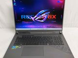 the asus rog strix laptop is open and ready to be used