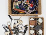 a basket full of assorted watches and other items