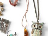 a picture of a collection of jewelry on a white surface