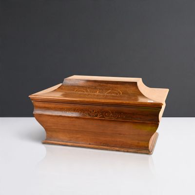 an image of a wooden box on a table with a black background