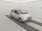 a picture of a small silver car in a garage