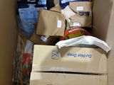 a cardboard box filled with boxes of food and other items