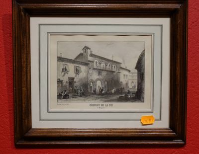 framed photograph of a building with a clock tower and people outside