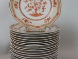 many plates stacked on top of each other on a table