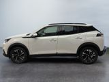 a white nissan rav parked in a garage