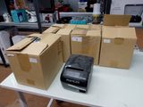 many boxes on a table with a cell phone on it