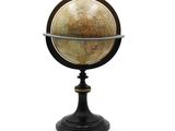 an image of a small globe on a stand on a white background